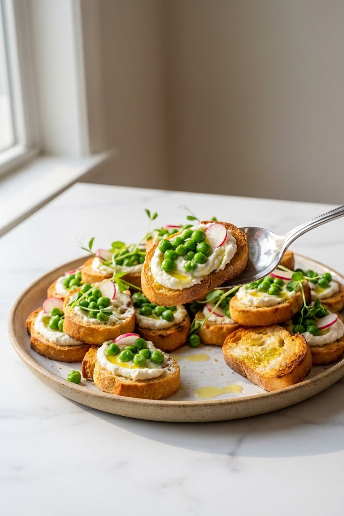 Whipped Feta and Spring Pea Crostini ready to serve
